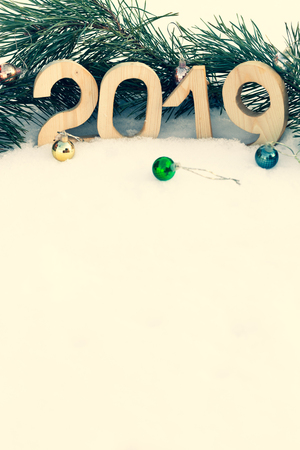 New year and christmas theme with fir branches and snow. 2019. Selective focus. Toned.の写真素材