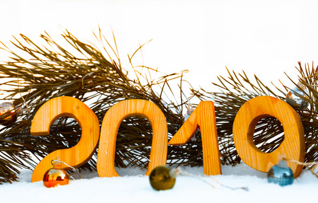 New year and christmas theme with fir branches and snow. 2019. Selective focus. Toned.