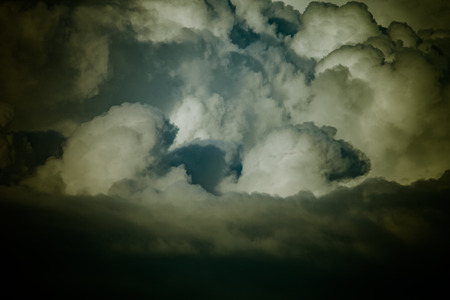 Blue sky with white cumulus clouds. Toned.の写真素材
