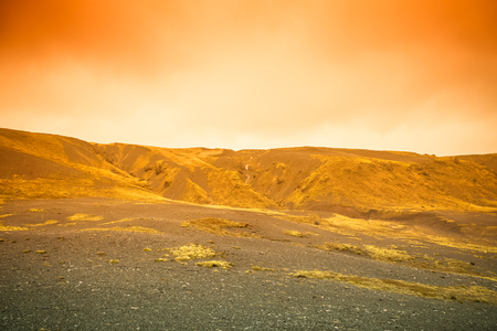 Clean water of famous Iceland waterfalls on a stony rocky mountain landscape. Toned.の写真素材