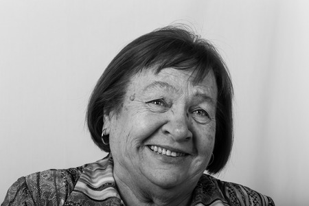 Portrait of an elderly laughing woman. Toned.