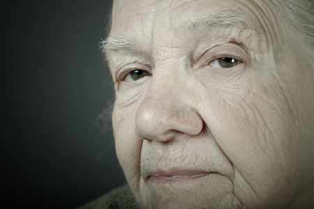 Portrait of elderly woman. Closeup view. Toned.の写真素材