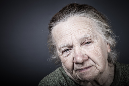 Portrait of elderly woman. Sleepy. Toned.の写真素材