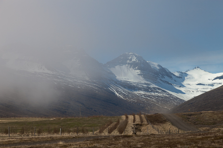 Foggy multicolored spring landscape of Iceland.の写真素材