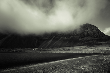 Beautiful spring sea landscape with low clouds in Iceland fjord. Toned.の写真素材
