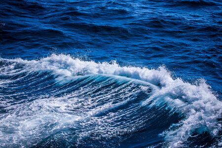 Blue water on the surface of the Pacific Ocean. Natural background. Toned.の写真素材