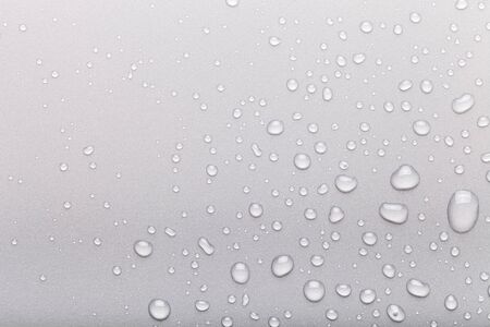 Drops of water on a color background. Gray.の写真素材