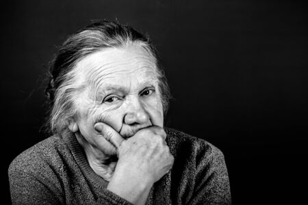 Portrait of elderly woman. Thoughtfulness. Toned.の写真素材