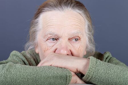 Portrait of elderly woman. Thoughtfulness.の写真素材