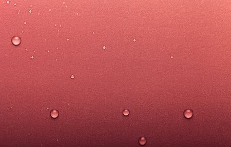 Drops of water on a color background. Selective focus. Red. Toned.の写真素材