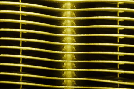 Metal surface of the radiator for a tecnical background. Toned.