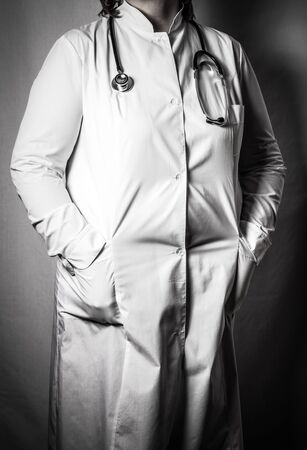Woman doctor in uniform with a phonendoscope. Toned.の写真素材