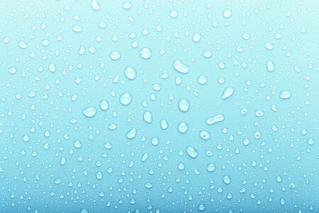 Drops of water on a color background. Selective focus. Blue. Toned.の写真素材