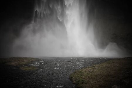 Famous Iceland waterfalls with a clean water on a stony rocky mountain landscape. Toned.