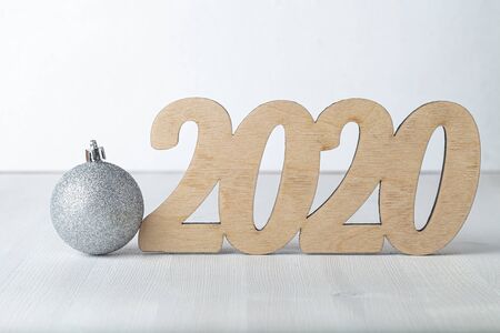 New year composition with wooden figures 2020.