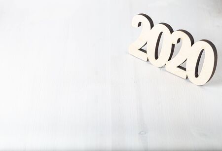New year composition with wooden figures 2020.