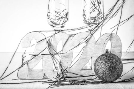 New year composition with wooden figures 2020. Toned.