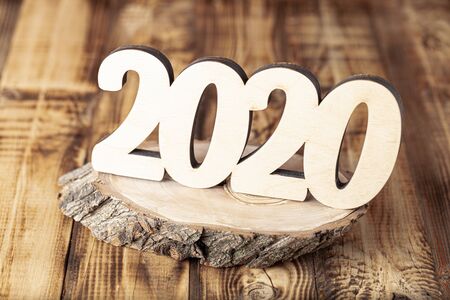 New year composition with wooden figures 2020.