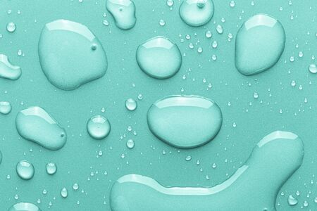 Drops of water on a color background. Toned.の写真素材