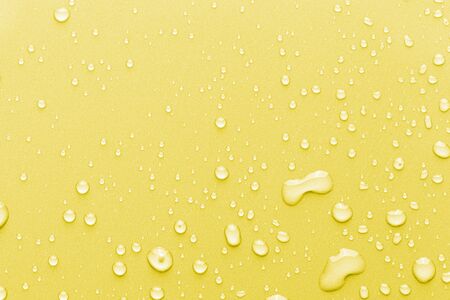 Drops of water on a color background. Toned.の写真素材