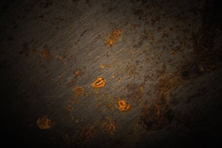 Abstract pattern of rust on old metal textured surface for background. Toned.