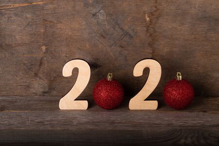 Wooden figures on the old wooden background. Happy new Year theme.