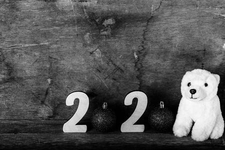 Wooden figures on the old wooden background. Happy new Year theme. Toned.の写真素材