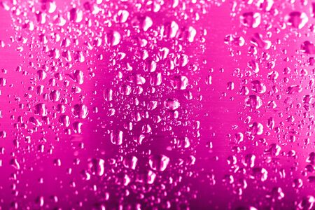 Drops of water on a glass background. Red. Selective focus. Toned.の写真素材