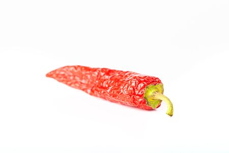 Bright red hot chili pepper isolated on white background.