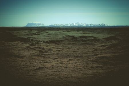 Stony rocky calm deserted spring landscape of Iceland. Toned.の写真素材