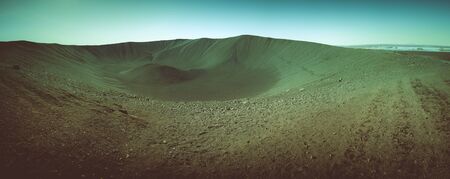 Black sand volcano mountain slope and lava remains in Iceland. Toned.の写真素材