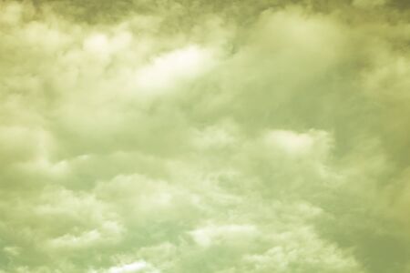 Beautiful white clouds on the natural background of the blue sky. Toned.