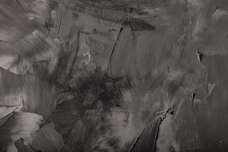 Textured plastered background with a variety of arbitrary stains. Gray.