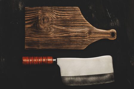 Chopping knives on a dark table. Toned.の写真素材