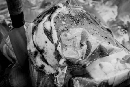 Composition with a meat prepared for cooking on a textured plastered surface. Toned.の写真素材