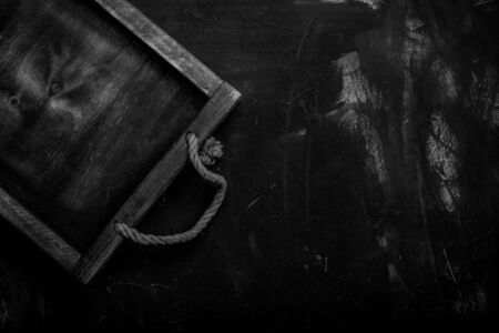Handmade wooden rustic items on a plastered textured table for background. Space fo text. Toned.の写真素材