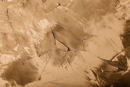 Textured plastered background with a variety of arbitrary stains. Toned.の写真素材