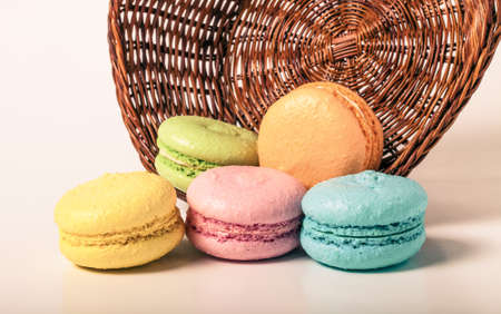 Colorful cake macaroons on a light background. Toned.の写真素材