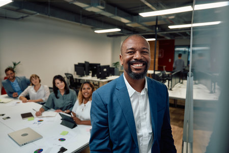 Group of multiracial business people smiling next to whiteboard during meeting in corporate office