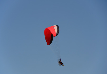 Paraglider on clear skyの写真素材