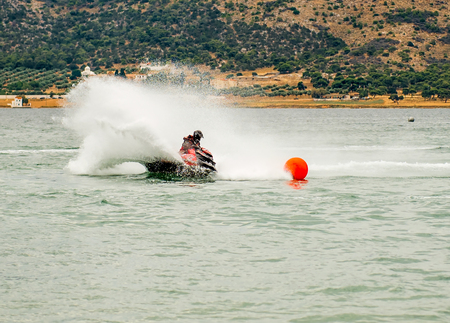 Man on Jet Ski turns fast on the water speed games