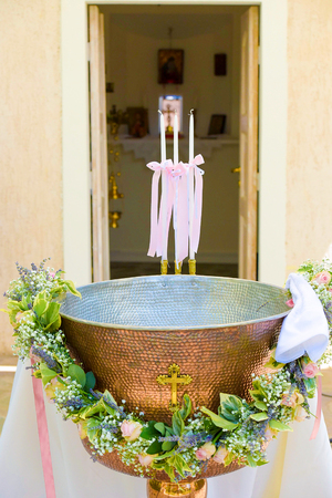 Orthodox Baptism Bowl prepared for christening ceremony in greek church