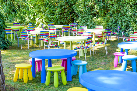 Garden decorated for Children Party. Modern and comfortable soft sets of children's colourful furniture, small tables and chairsの写真素材
