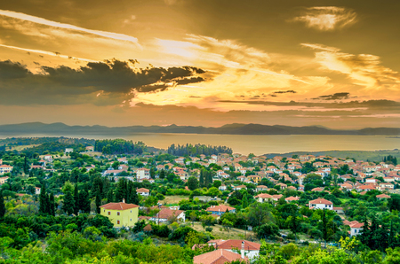 Sunset over village on Pagasitikos gulf. Greece.の写真素材