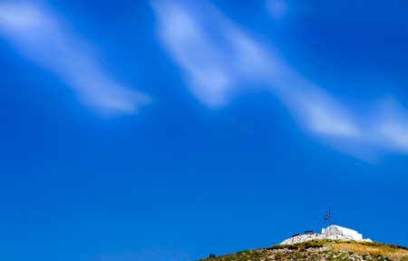 Heaven's touch. A very small greek orthodox chapel on top of the hill. Greek islands.