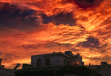 A very dramatic red sky over the city.の写真素材