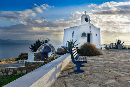 Typical greek place with a white small orthodox chapel dedicated to St Nikolaos.Rafina,Greece