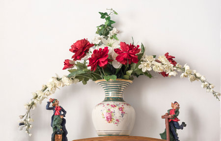 vintage decoration with roses and other flowers on vaseの写真素材