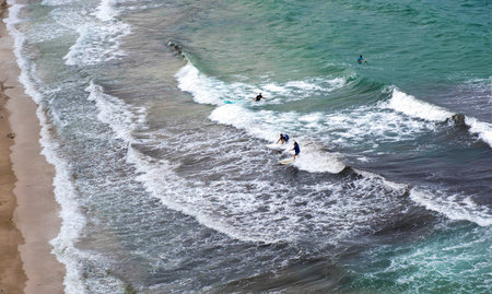 Drone view. Beach with amateur surfers in Rafina, Greeceの写真素材