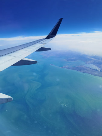 Airplane's wing. Amazing view flying over Persian gulfの写真素材